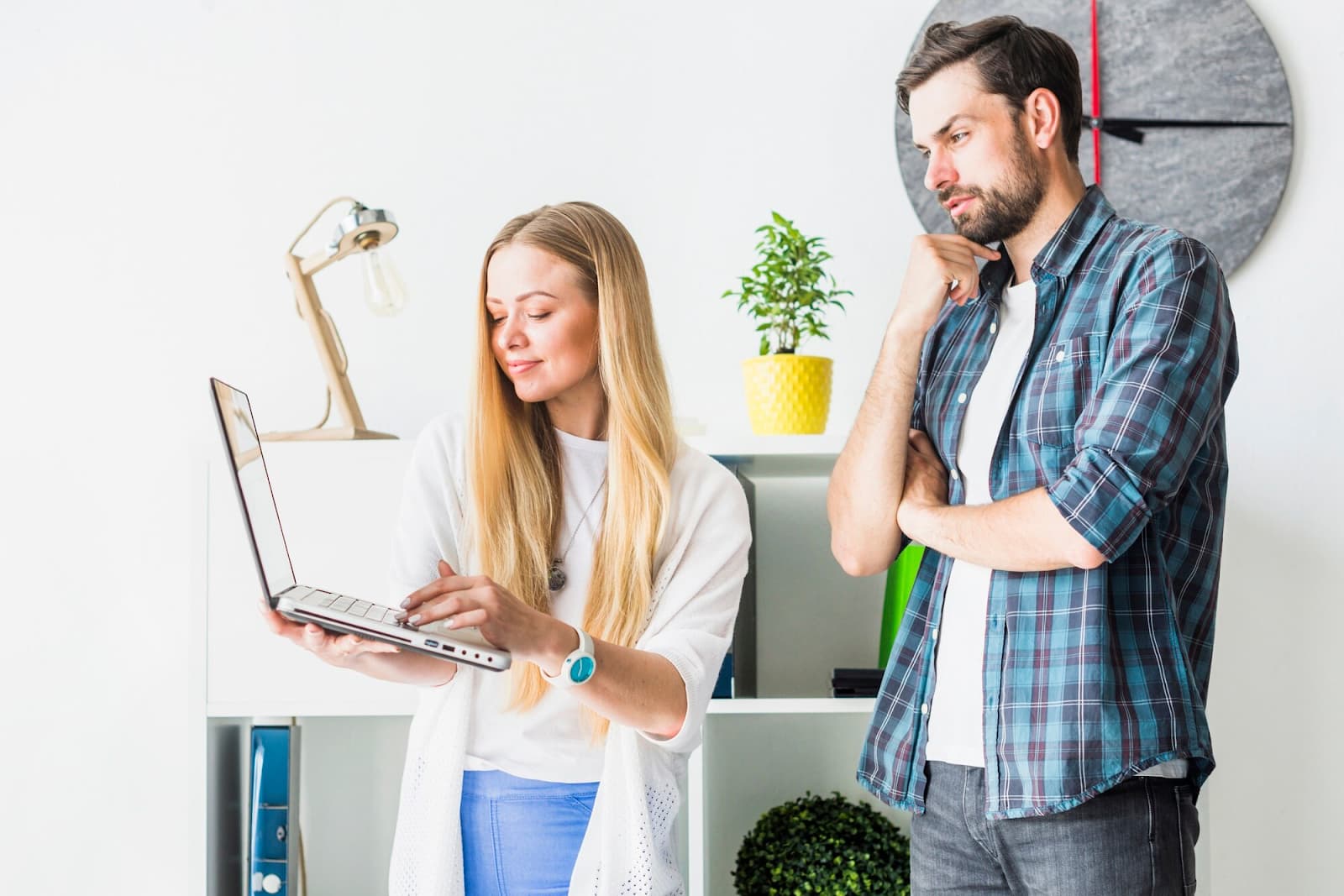 Two business people working on laptop